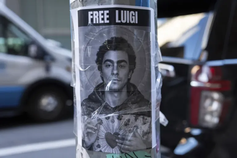 A poster depicting Luigi Mangione.