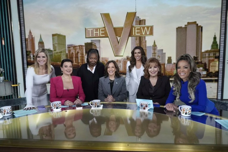 Democratic presidential nominee Vice President Kamala Harris is photographed with the hosts during a commercial break at The View, Tuesday, Oct. 8, 2024, in New York. From left are Sara Haines, Ana Navarro, Whoopi Goldberg, Harris, Alyssa Farah Griffin, Joy Behar and Sunny Hostin. (AP Photo/Jacquelyn Martin)