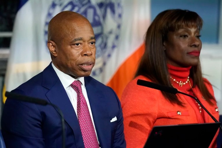 New York Mayor Eric Adams, accompanied by Ingrid Lewis-Martin, his chief advisor, responds to questions during a news conference at New York's City Hall, Nov. 14, 2023.