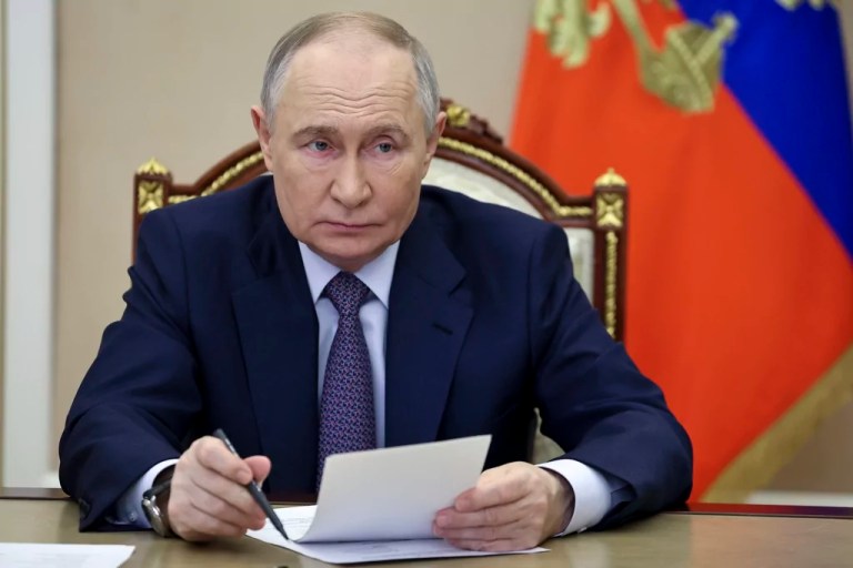 Russian President Vladimir Putin speaks as he attends a ceremony to launch new air and road infrastructure facilities in various regions via videoconference at the Kremlin in Moscow, Russia, Sunday, Dec. 22, 2024.