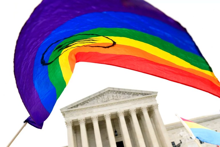 In this Oct. 8, 2019, file photo, protesters gather outside the Supreme Court in Washington, where the Supreme Court is hearing arguments in the first case of LGBT rights since the retirement of Supreme Court Justice Anthony Kennedy.
