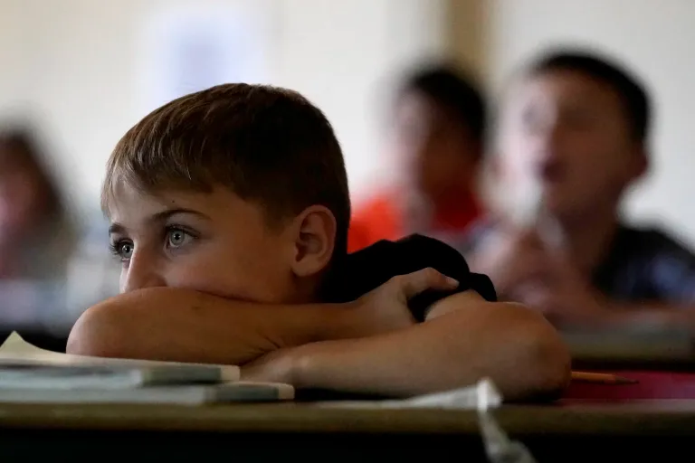 Conner Dowell listens to a lesson in his third grade classroom at Highland Elementary School in Columbus, Kansas, on Monday, Oct. 17, 2022. Third graders in the tiny 900-student Columbus school district have fought to catch up on reading in the wake of COVID-19 disruptions.