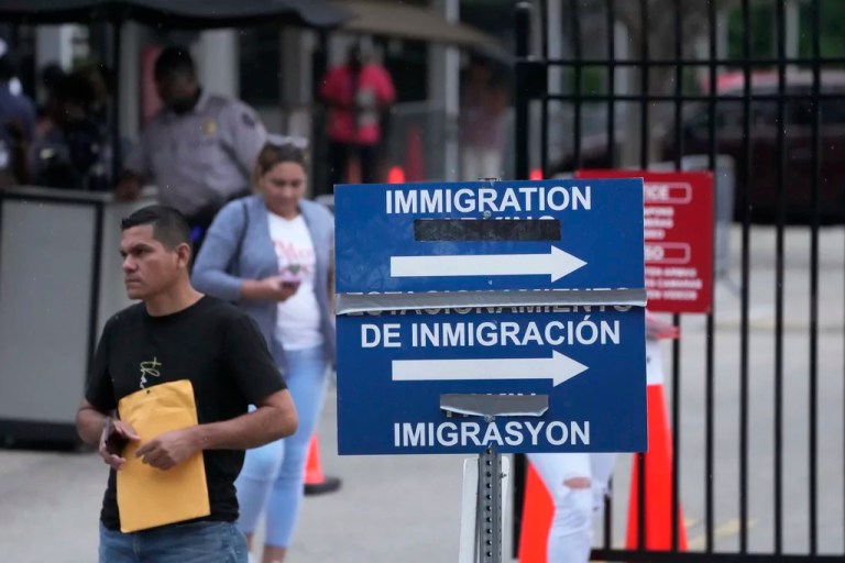 People leave the Immigration and Customs Enforcement offices, Wednesday, July 26, 2023, in Miramar, Florida.