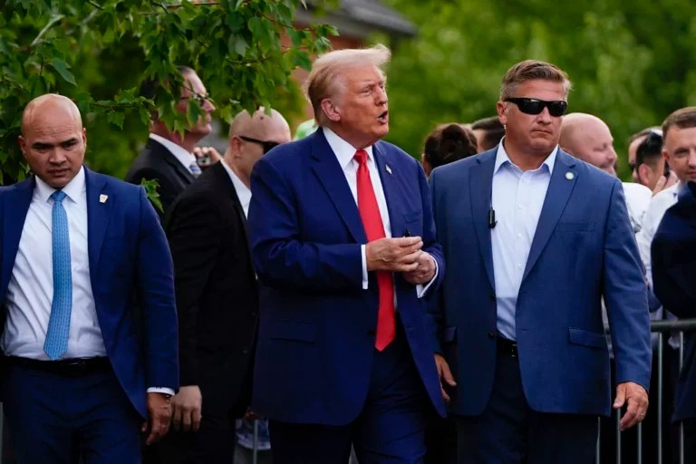 Republican presidential nominee former President Donald Trump walks after a news conference at Trump National Golf Club, Thursday, Aug. 15, 2024, in Bedminster, N.J. At left is Walt Nauta, personal aide to Trump. (AP Photo/Julia Nikhinson)