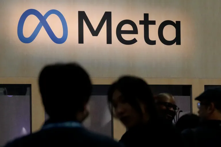 Attendees visit the Meta booth at the Game Developers Conference in San Francisco, March 22, 2023.