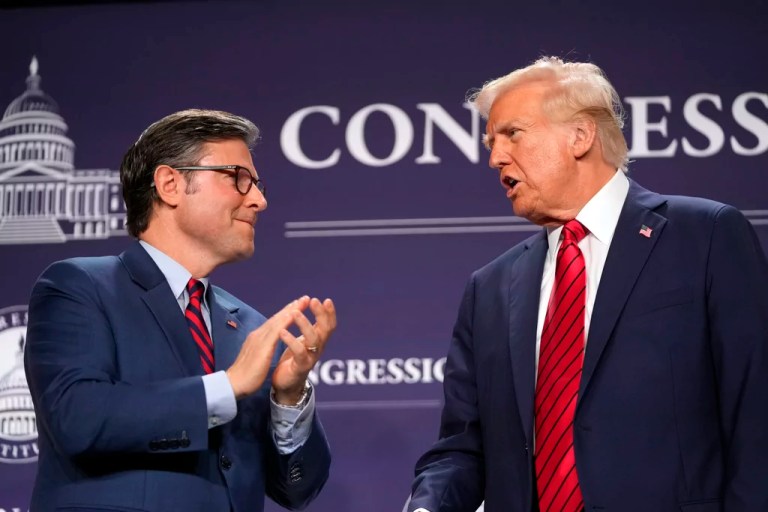 President Donald Trump looks to House Speaker Mike Johnson (R-LA) before he speaks at the 2025 House Republican Members Conference Dinner at Trump National Doral Miami in Doral, Florida, Monday, Jan. 27, 2025.