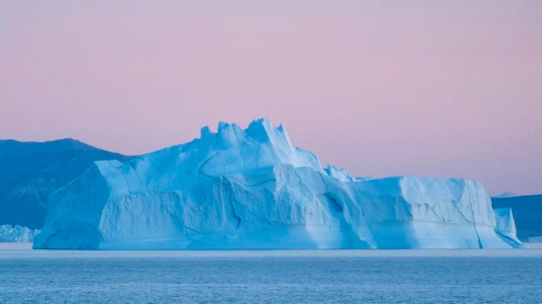An iceberg floats in Greenland.