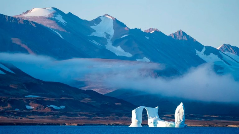 An iceberg floats in the Scoresby Sund, Tuesday, Sept. 12, 2023, in Greenland.
