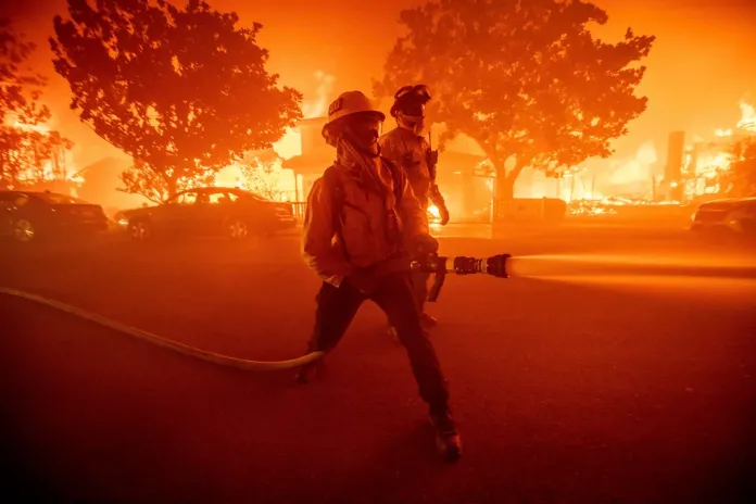 Firefighters battle the Palisades Fire.