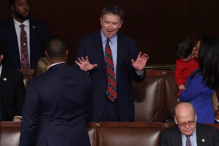 Rep. Thomas Massie (R-KY) speaks to colleagues in the House Chamber of the U.S. Capitol in Washington, D.C., on Friday, Jan. 3, 2025. Rep. Lauren Boebert (R-CO) holds her grandchild Tyler on his right.
