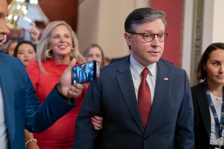 Speaker of the House Mike Johnson, R-La., accompanied by his wife Kelly Johnson, left, walks to the House Chamber before starting the 119th United States Congress at the Capitol in Washington, Friday, Jan. 3, 2025.
