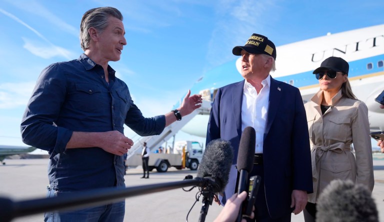 President Donald Trump and first lady Melania Trump listen to California Gov. Gavin Newsom after arriving on Air Force One at Los Angeles International Airport in Los Angeles, Friday, Jan. 24, 2025.