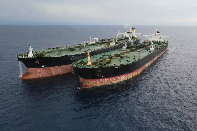 In this undated photo released Tuesday, July 11, 2023, by the Indonesian Maritime Security Agency, Iranian-flagged, MT Arman 114 and Cameroon-flagged tanker, MT S Tinos, are seen after they are caught conducting an illegal oil transfer near Natuna waters, Indonesia.