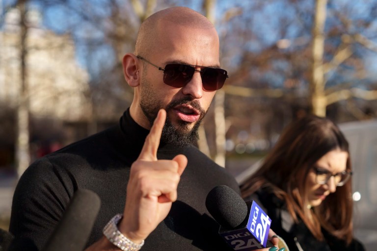 Andrew Tate gestures while speaking outside the Bucharest Tribunal in Bucharest, Romania, Thursday, Jan. 9, 2025.