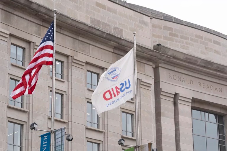 The flag of the U.S. Agency for International Development flies alongside the American flag in front the USAID office in Washington, Monday, Feb. 3, 2025.