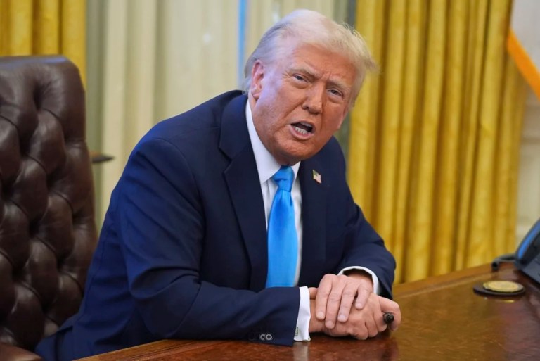 President Donald Trump speaks to reporters as he signs executive orders in the Oval Office of the White House, Tuesday, Feb. 4, 2025, in Washington. (AP Photo/Evan Vucci)