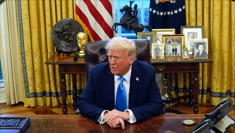 President Donald Trump speaks to reporters as he signs executive orders in the Oval Office of the White House, Tuesday, Feb. 4, 2025, in Washington.