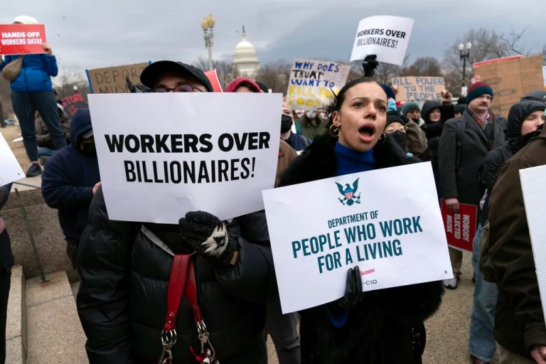 People protest during a rally against Elon Musk outside the U.S. Department of Labor in Washington, Wednesday, Feb. 5, 2025. (AP Photo/Jose Luis Magana)