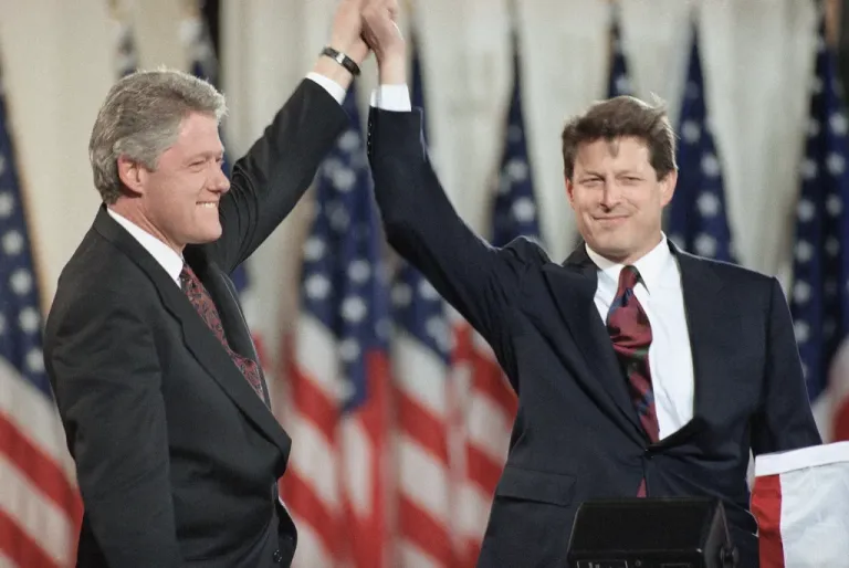 President-elect Bill Clinton stands with his running mate, Al Gore, onstage.
