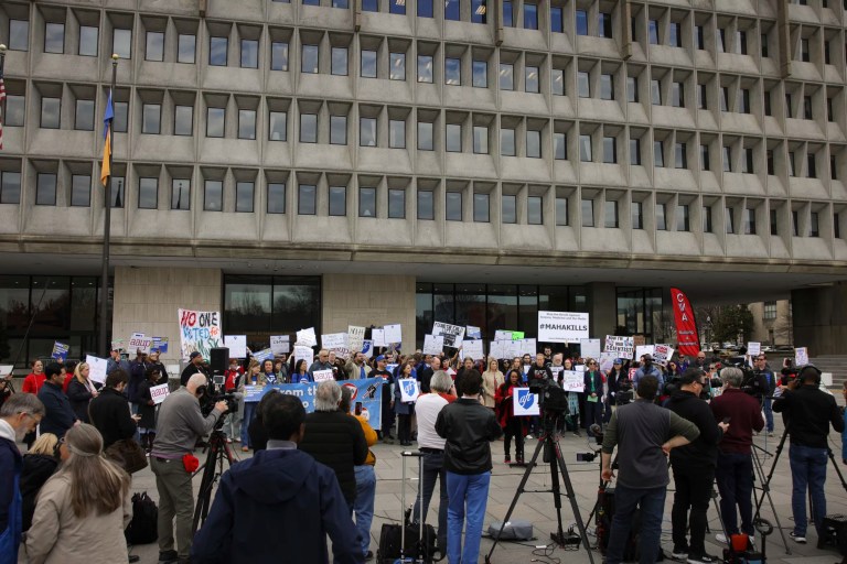 Workers hold a rally and press conference outside of the offices of the Department of Health and Human Services in Washington, D.C., Feb. 25, 2025, to protest against Elon Musk's Department of Government Efficiency budget cuts and employee terminations in the healthcare, academic, and research fields, and to support federal workers.