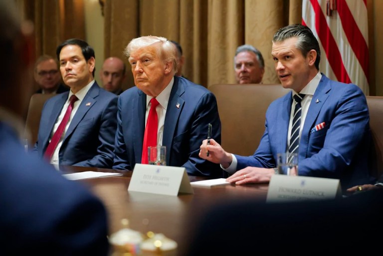 President Donald Trump listens during a Cabinet meeting at the White House in Washington, Wednesday, Feb. 26, 2025, as Secretary of State Marco Rubio and Defense Secretary Pete Hegseth listen.
