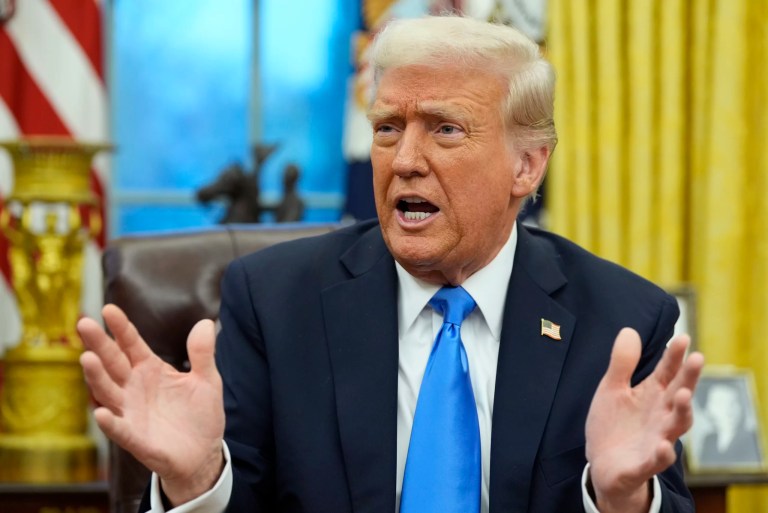 President Donald Trump speaks with reporters in the Oval Office at the White House, Tuesday, Feb. 11, 2025, in Washington.