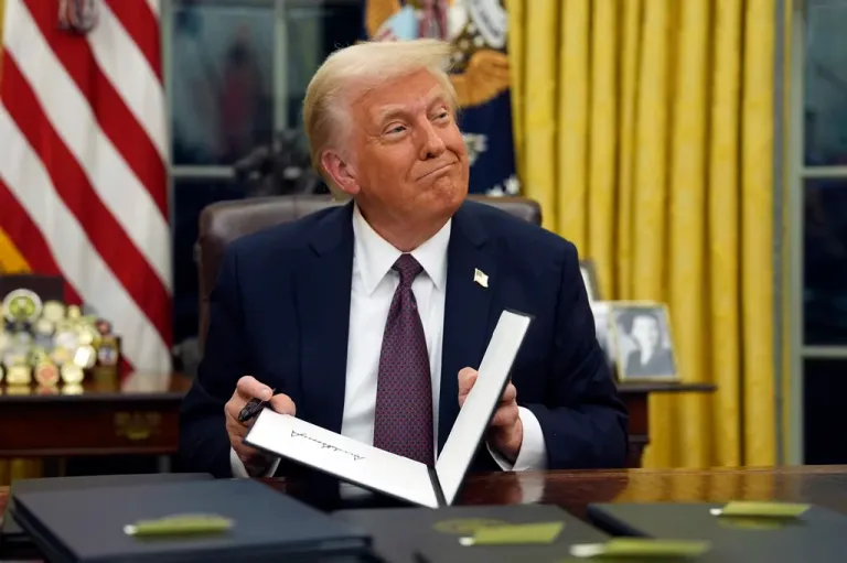President Donald Trump signs executive orders in the Oval Office of the White House, Monday, Jan. 20, 2025, in Washington.