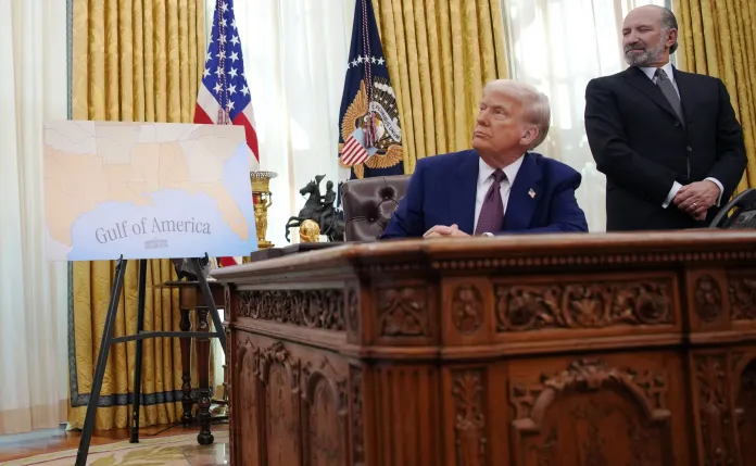 President Donald Trump listens during a signing of an executive order.