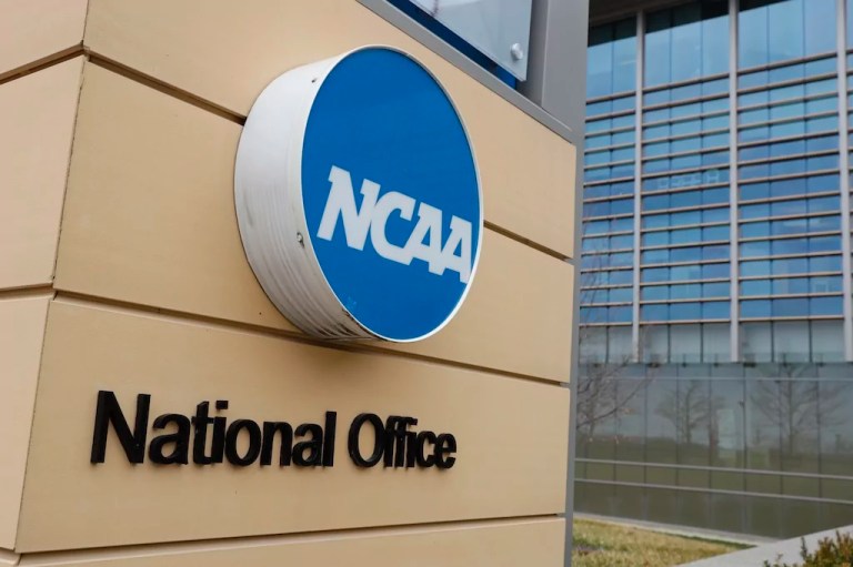 Signage at the headquarters of the NCAA is viewed in Indianapolis, March 12, 2020.