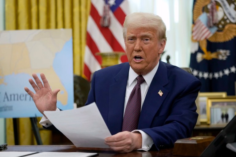 President Donald Trump speaks to reporters in the Oval Office of the White House, Feb. 13, 2025, in Washington.
