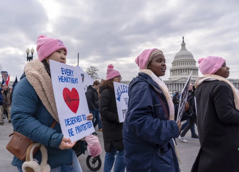 Anti-abortion activists walk past the Capitol in the annual March for Life, in Washington, Friday, Jan. 24, 2025. (AP Photo/J. Scott Applewhite)