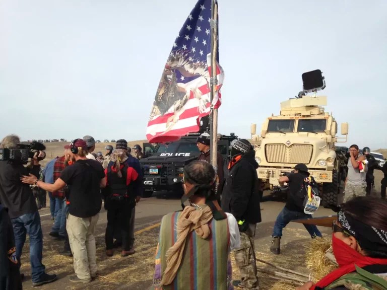 Dakota Access pipeline protesters defy law enforcement officers who are trying to force them from a camp on private land in the path of pipeline construction, Oct. 27, 2016, near Cannon Ball, N.D.
