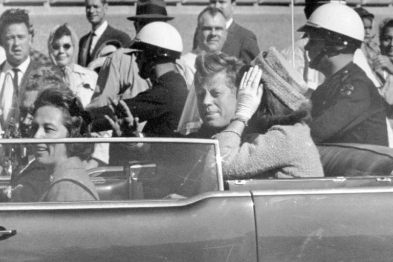 Former President John F. Kennedy waves from his car in a motorcade in Dallas, with former first lady Jacqueline Kennedy, right, Nellie Connally, second from left, and her husband, Texas Gov. John Connally, far left, Nov. 22, 1963.