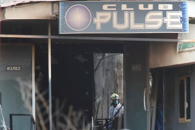 A firefighter inspects a nightclub after a massive fire in the town of Kocani, North Macedonia, Sunday, March 16, 2025.