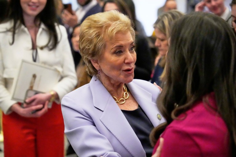 Education Secretary Linda McMahon greets Sen. Katie Britt (R-AL) before President Donald Trump addresses a joint session of Congress at the Capitol in Washington.