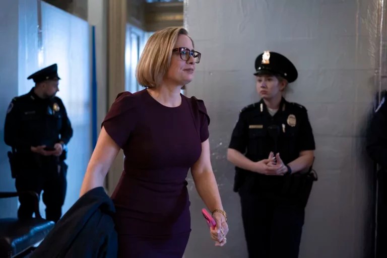 Sen. Kyrsten Sinema, an Arizona independent who has been central to Senate border security talks, leaves the chamber as the Senate moves toward a final vote on an emergency spending package that would provide military aid to Ukraine and Israel, replenish U.S. weapons systems and provide food, water and other humanitarian aid to civilians in Gaza, at the Capitol in Washington, Sunday, Feb. 11, 2024.