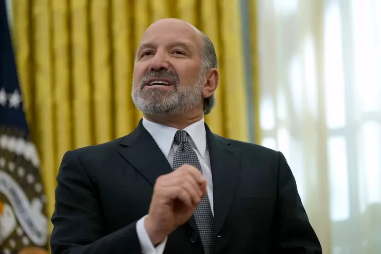 Commerce Secretary nominee Howard Lutnick speaks in the Oval Office of the White House after President Donald Trump signed an executive order, Thursday, Feb. 13, 2025, in Washington.