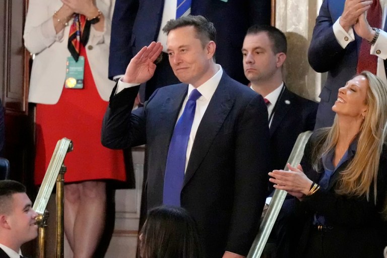 Elon Musk gestures as President Donald Trump addresses a joint session of Congress at the Capitol in Washington, Tuesday, March 4, 2025. (AP Photo/Alex Brandon)