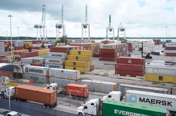 Trump plans tariffs on allies with value-added taxes: What to know Dockworkers return to work at PortMiami after the union representing 45,000 striking U.S. dockworkers reached a deal to suspend a three-day strike, Friday, Oct. 4, 2024, in Miami.