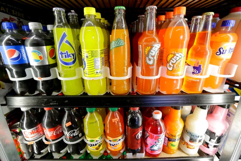 In this Wednesday, Sept. 21, 2016, file photo, soft drink and soda bottles are displayed in a refrigerator at El Ahorro market in San Francisco.