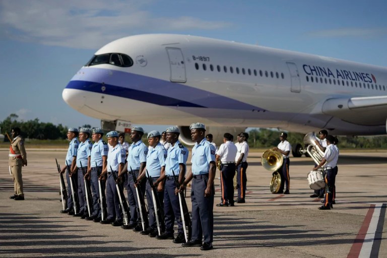 A honor guard stands as Taiwan's President Tsai Ing-wen aircraft arrives to Philip S.W. Goldson International Airport in Belize City, Sunday, April 2, 2023.