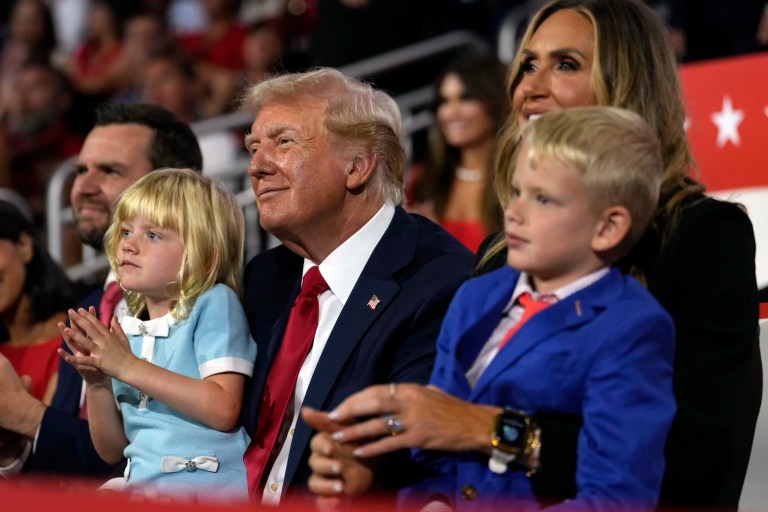 President Donald Trump sits with Lara Trump and her children Luke and Carolina during the 2024 Republican National Convention at the Fiserv Forum, Thursday, July 18, 2024, in Milwaukee.
