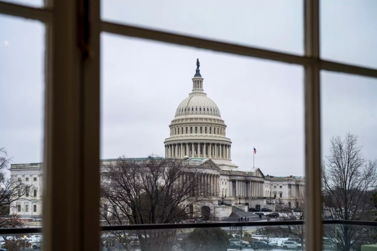 The Capitol is seen framed through a window in the Cannon House Office Building on Capitol Hill in Washington, Thursday, Feb. 13, 2025.