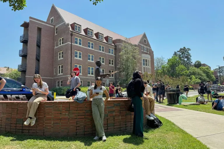 Florida State University students wait for news amid an active shooter incident at the school’s campus in Tallahassee, Thursday, April 17, 2025
