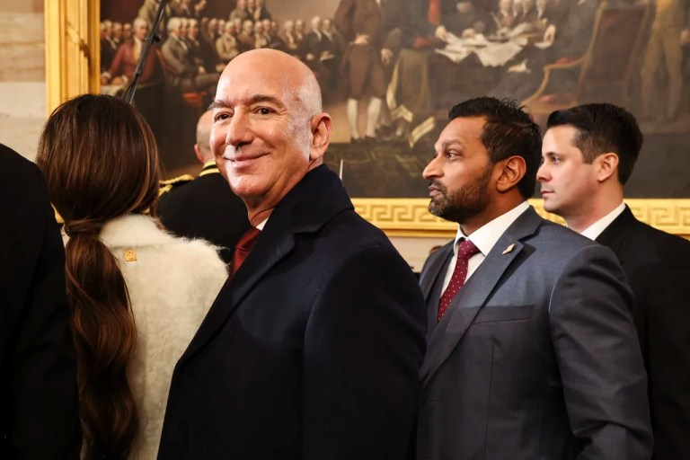 Amazon founder Jeff Bezos, left, and Kash Patel, FBI director nominee, look on after the 60th Presidential Inauguration in the Capitol Rotunda in Washington, Monday, Jan. 20, 2025.