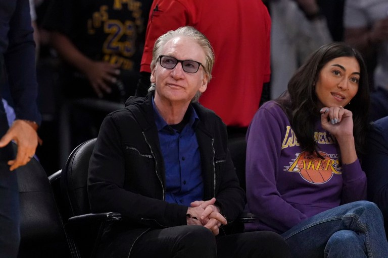 Comedian Bill Maher watches during the first half of an NBA basketball game between the Los Angeles Lakers and the Golden State Warriors, Thursday, April 3, 2025, in Los Angeles.