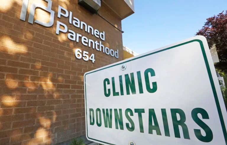 A sign is displayed at Planned Parenthood of Utah Wednesday, Aug. 21, 2019, in Salt Lake City. About 39,000 people received treatment from Planned Parenthood of Utah in 2018 under a federal family planning program called Title X. The organization this week announced it is pulling out of the program rather than abide by a new Trump administration rule prohibiting clinics from referring women for abortions.