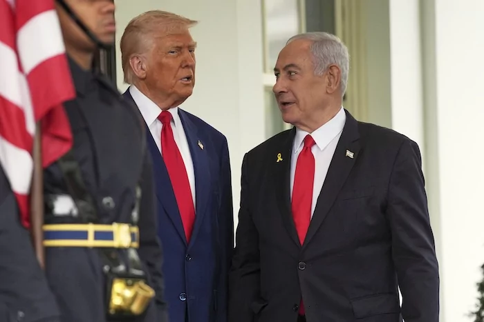 President Donald Trump, left, greets Israel's Prime Minister Benjamin Netanyahu at the White House, Monday, April 7, 2025, in Washington.