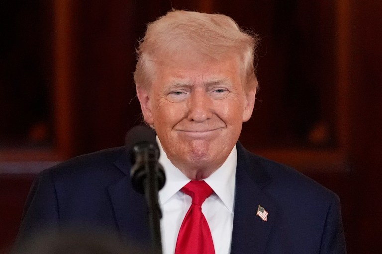 President Donald Trump walks on the South Lawn as he arrives at the White House on Marine One, Sunday, April 6, 2025