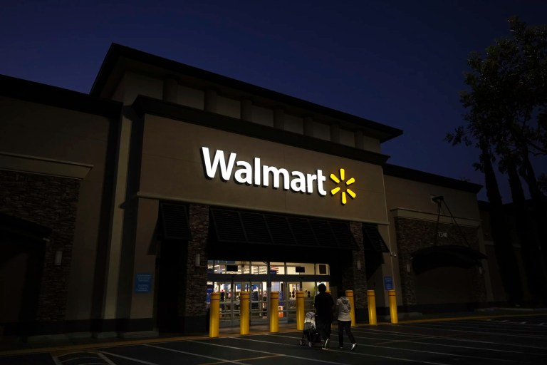A family walks into a Walmart store in La Habra, California, Wednesday, April 9, 2025.